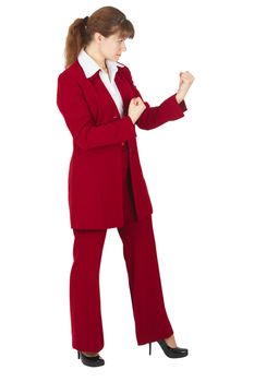 Young woman standing in a combat stance on a white background