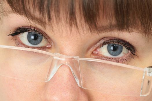 Women look over his spectacles close up