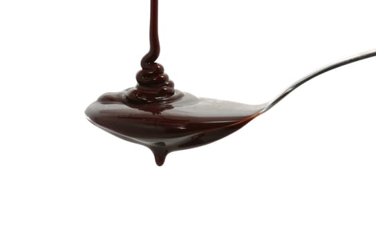 chocolate syrup on a spoon