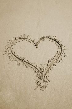 a heart written in the sand