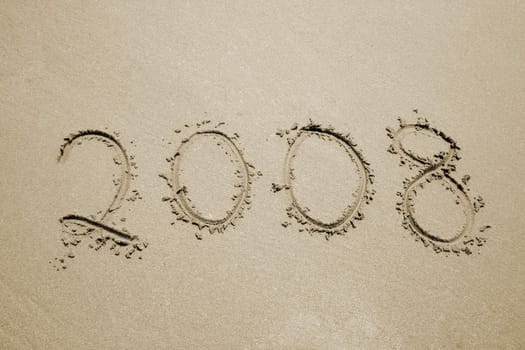 the number 2008 written in the sand