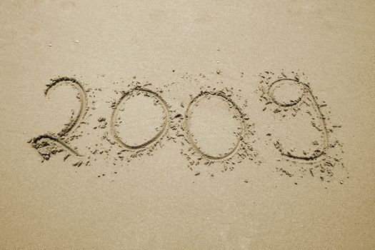 the number 2009 written in the sand