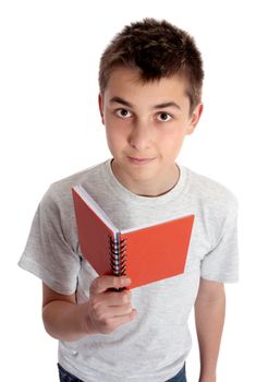 Child holding a red book and looking up.
