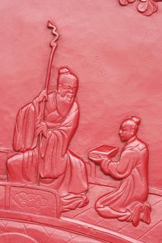 Detail of an ancient carved door in a temple in China