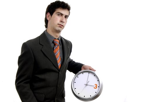 young handsome business man holding a clock