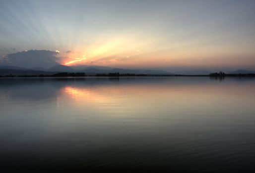 Colorado sunset over Rocky Mountains and a calm lake - HDR image with realistic tone mapping, copy space