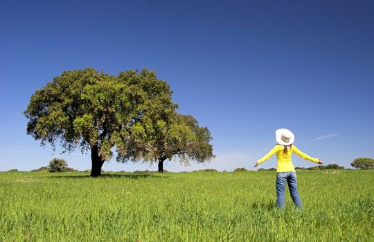 happy woman on a beautiful green meadow