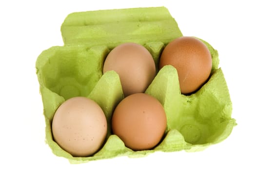 four eggs in a green box