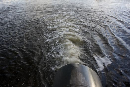 outflow of a big pipe supplying water from river reservoir lake for farmland irrigation