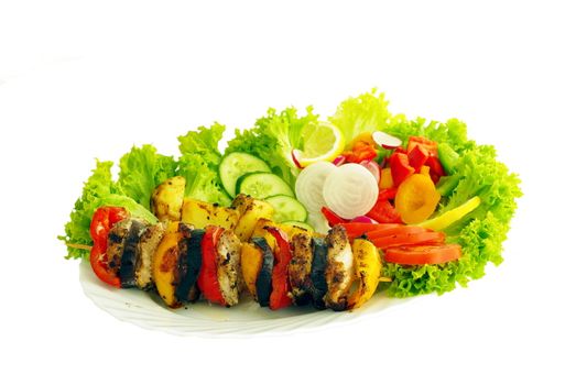 barbecue and vegetable on plate on white background