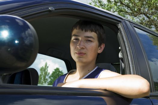 19th years old man driver in a car