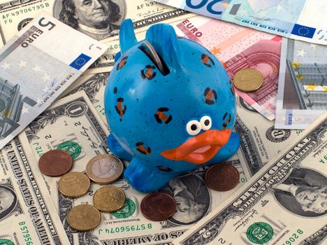 Blue fish piggy bank for banknotes and coins.