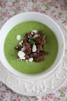 Delicious peasoup with green peas, feta and croutons