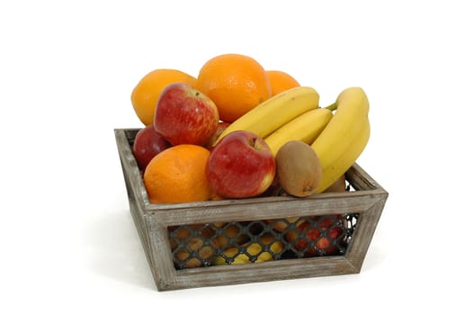Fruit basket on a white background. The basket is made out of wood.