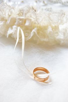 Wedding ring on satin and lace