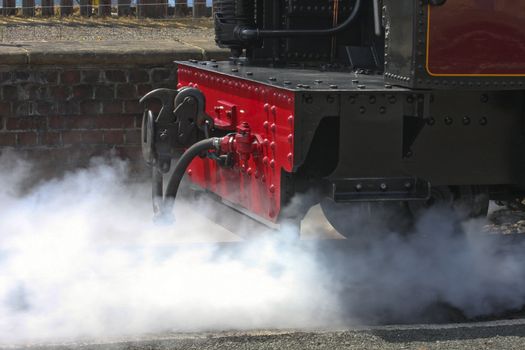Steam train venting steam Aberystwyth Wales on its way to Devils Bridge