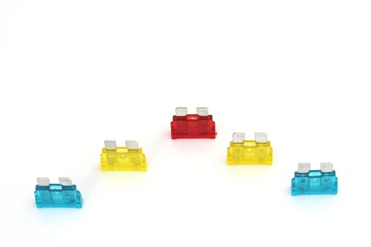 Electrical automotive car fuses or breakers isolated on a white background
