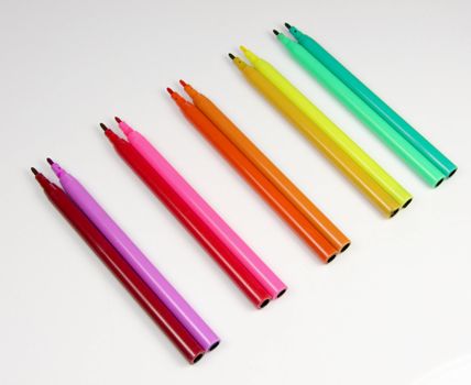 Coloured or colored felt tip pens in a colour spectrum isolated on a white background