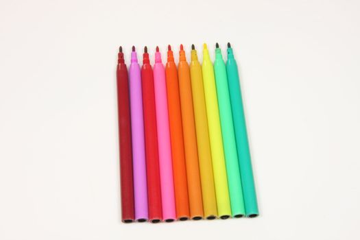 Coloured or colored felt tip pens in a colour spectrum isolated on a white background