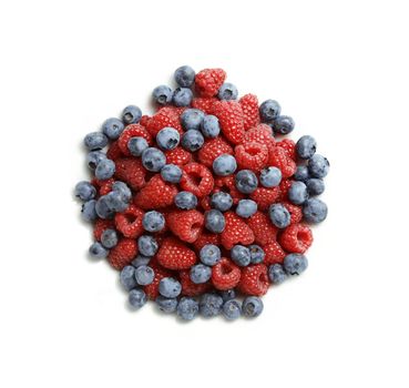 Delicious blueberries and red raspberries isolated on white background - large XXL file shot in studio