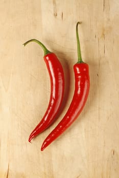 Red hot chilli peppers on a cutting board