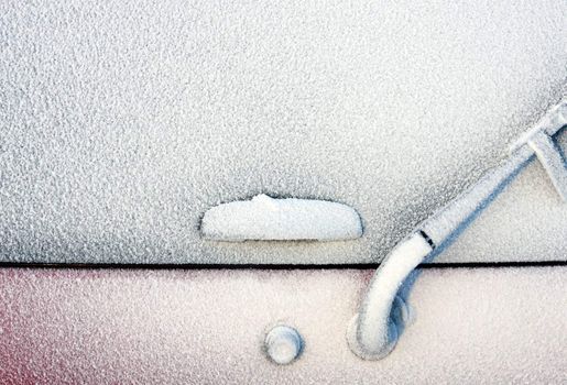 Backside of a 4x4 completely covered with frost after a winter blizzard
