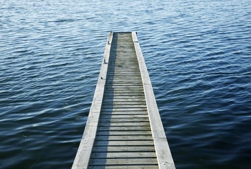 Beautiful lake scene of a wooden pier