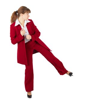 Beautiful girl in business suit kicks, isolated on a white background