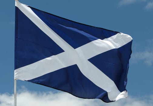 The national flag of Scotland blowing in the wind. 
