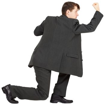 Young man beats his fist on a white background