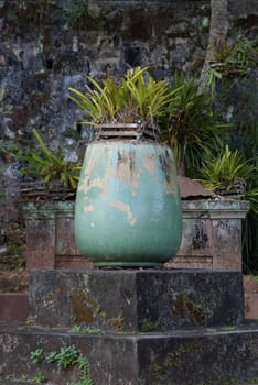 Old vase on stone steps