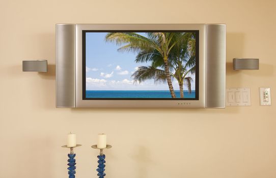 LCD TV & Speakers mounted on the wall.