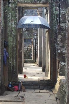 Umbrella in a stone ruin