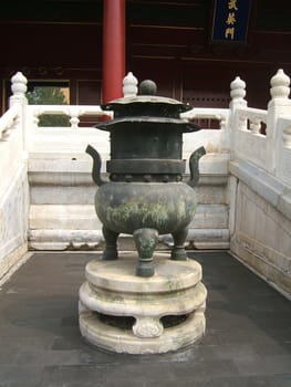 Antique bronze incense burner in the Forbidden city in Beijing