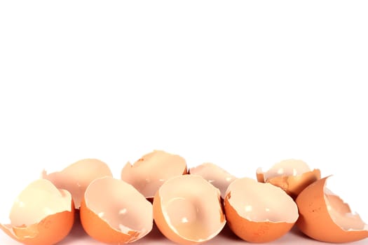 Broken egg shells on white background