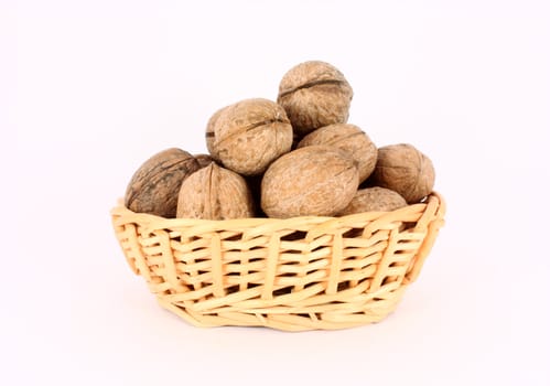 Wallnuts in a little basket, isolated
