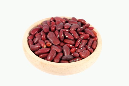 Little wooden bowl full of beans, isolated on white