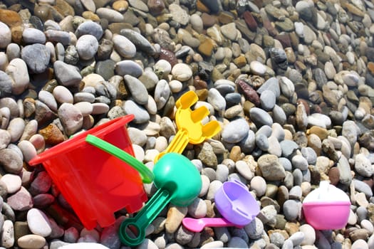 child toys on the pebble beach