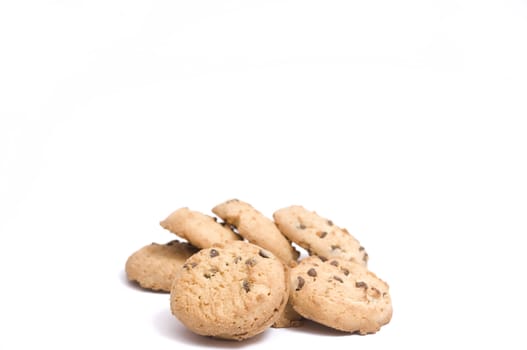 close-up on a stack of chocolate-chip cookies, isolated on white