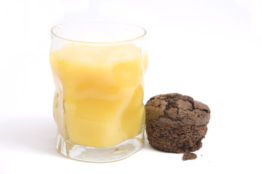 orange juice and chocolate muffin, isolated on white
