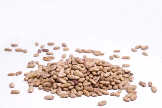 large pile of pinto beans isolated on white