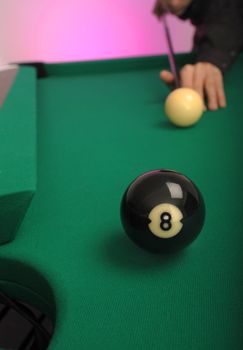 8 Ball in the side pocket on a pool (billard) table during play