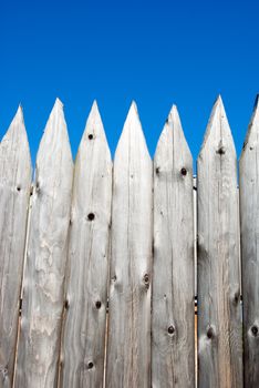 Wooden vintage background.wooden fence On a background of the blue sky