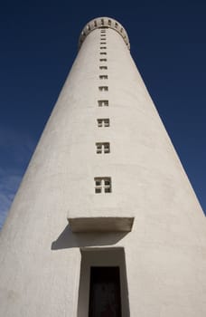 Old lighthouse on clear blue day