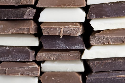 Many flavors of chocolate stacked up