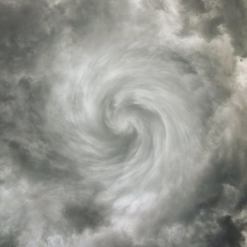 Twisting spiral dark sky with storm clouds