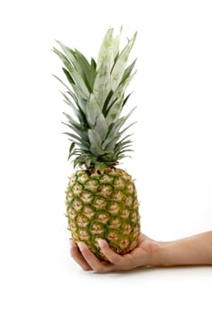 Womans hand with pineapple on bright background