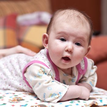 Portrait of a cute baby-girl with her mouth open