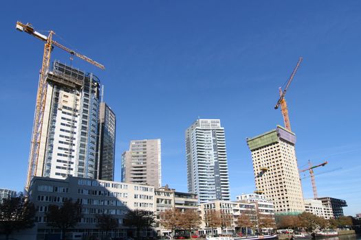 New apartment buildings being constructed along the river in Rotterdam