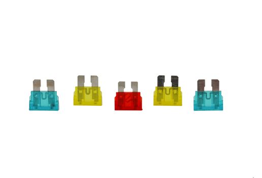 5 electrical car fuses or breakers red, yellow and blue isolated on a white background.